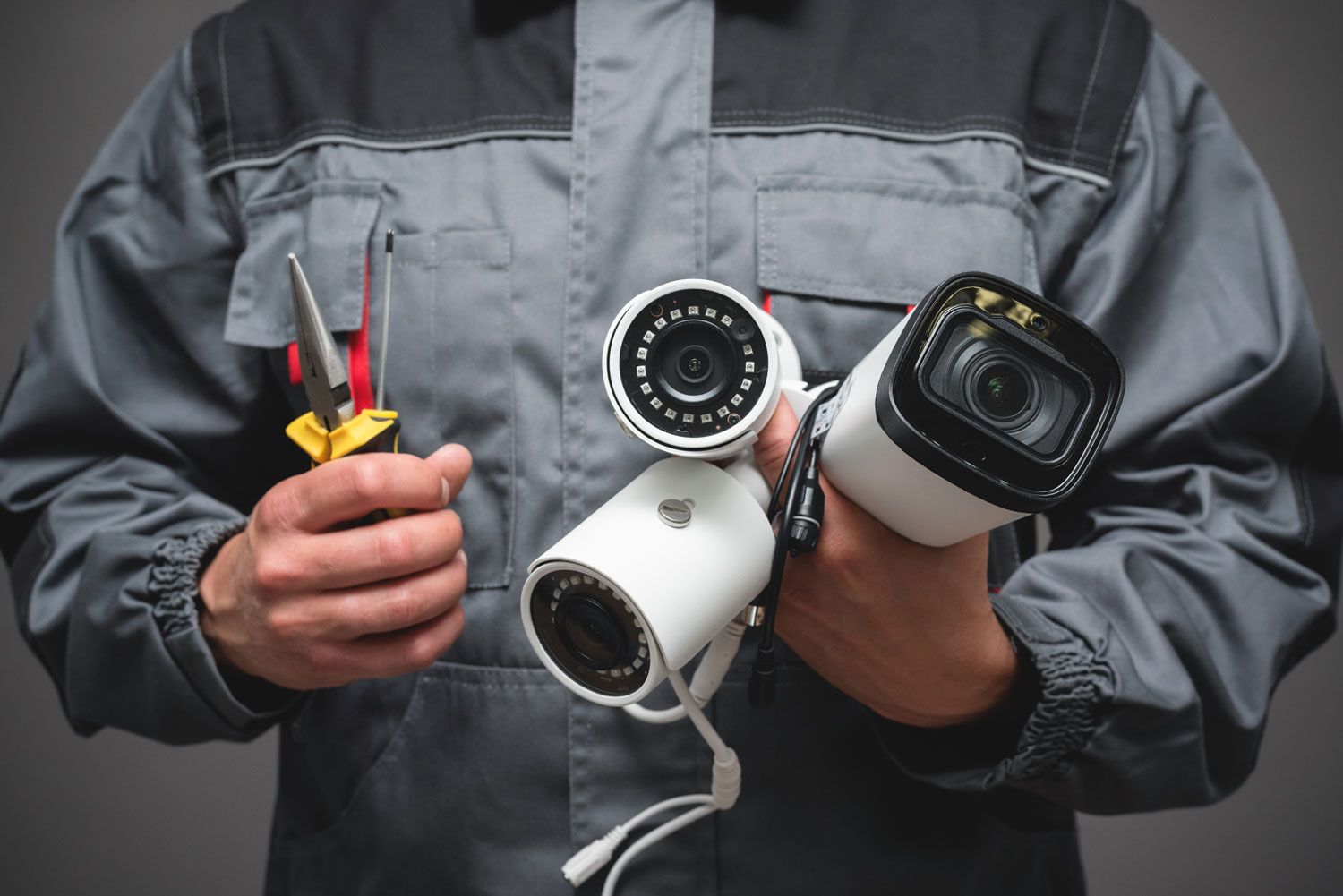 man holding cctv cameras